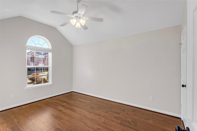 empty room with lofted ceiling, wood-type flooring, and ceiling fan