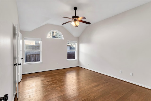 unfurnished room with ceiling fan, lofted ceiling, and dark hardwood / wood-style flooring