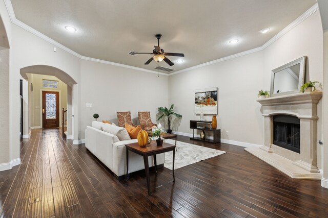 living room featuring ornamental molding, dark hardwood / wood-style floors, and ceiling fan