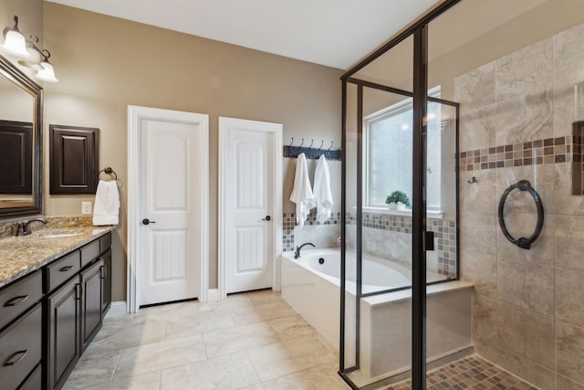 bathroom featuring vanity and shower with separate bathtub