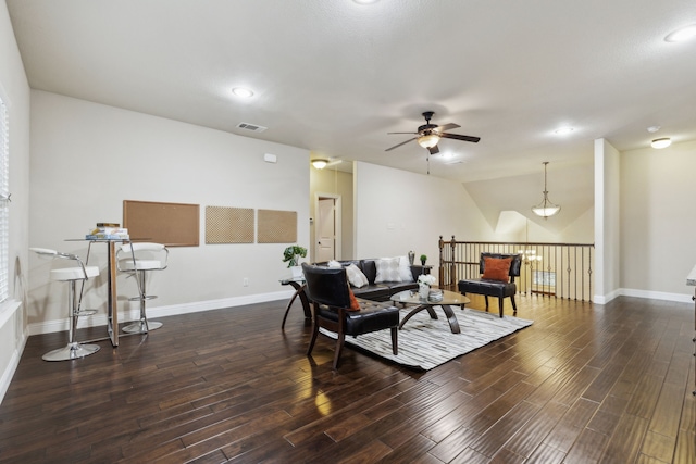 living room with vaulted ceiling, dark hardwood / wood-style floors, and ceiling fan