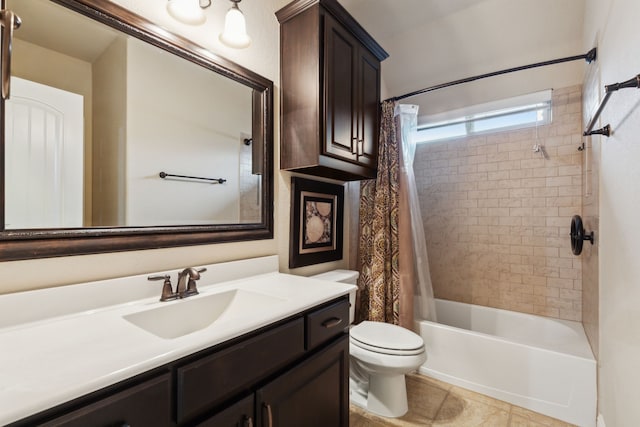 full bathroom featuring vanity, tile patterned floors, toilet, and shower / bath combo with shower curtain