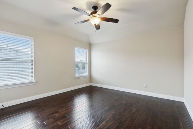 unfurnished room featuring vaulted ceiling, dark wood-type flooring, and ceiling fan