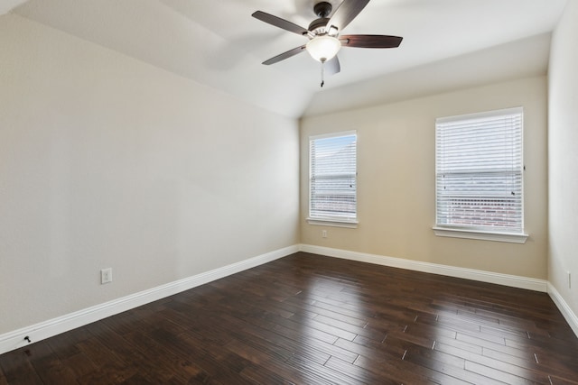 spare room featuring vaulted ceiling, ceiling fan, and dark hardwood / wood-style flooring