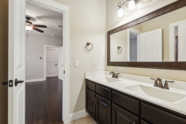 bathroom featuring ceiling fan, vanity, and hardwood / wood-style floors