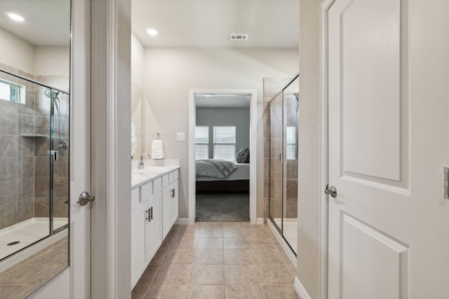 bathroom with vanity, tile patterned floors, and walk in shower