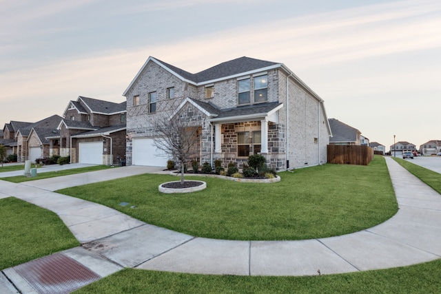 view of front facade featuring a garage and a lawn