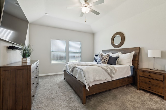 carpeted bedroom with ceiling fan and lofted ceiling