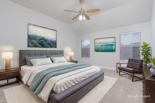 bedroom with vaulted ceiling, baseboards, a ceiling fan, and light colored carpet