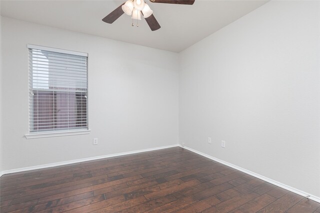 unfurnished room featuring a ceiling fan, baseboards, and dark wood-style flooring