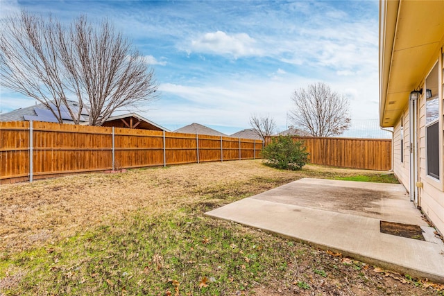 view of yard featuring a fenced backyard and a patio