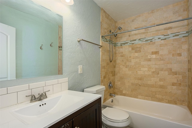 full bathroom featuring toilet, tiled shower / bath, a textured ceiling, vanity, and decorative backsplash