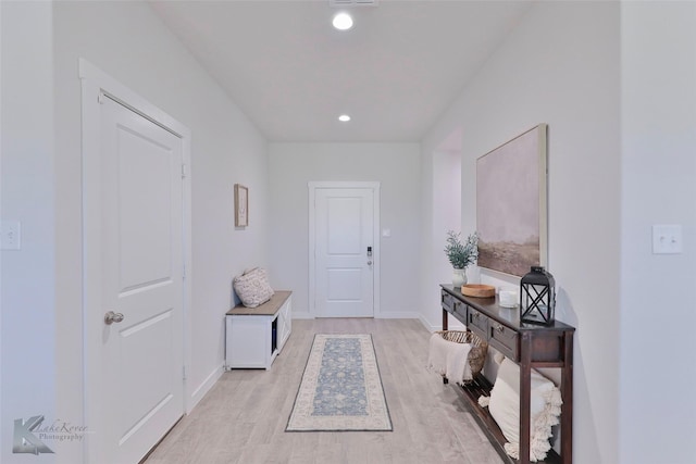 corridor featuring light hardwood / wood-style floors