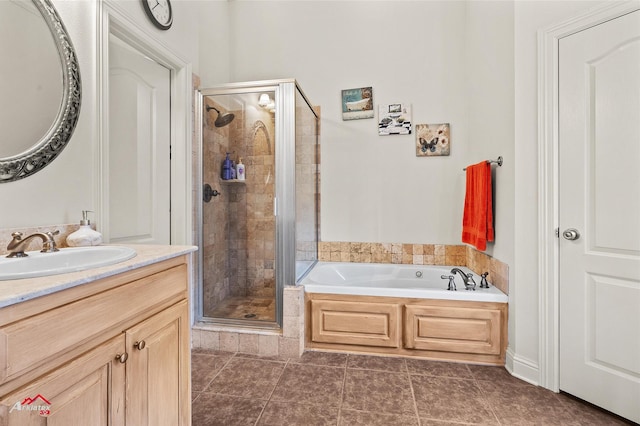 bathroom with vanity, plus walk in shower, and tile patterned flooring