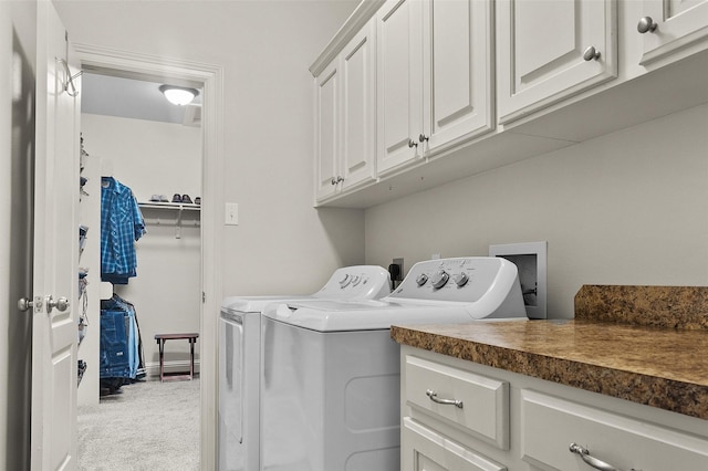 laundry room with cabinets, carpet, and independent washer and dryer