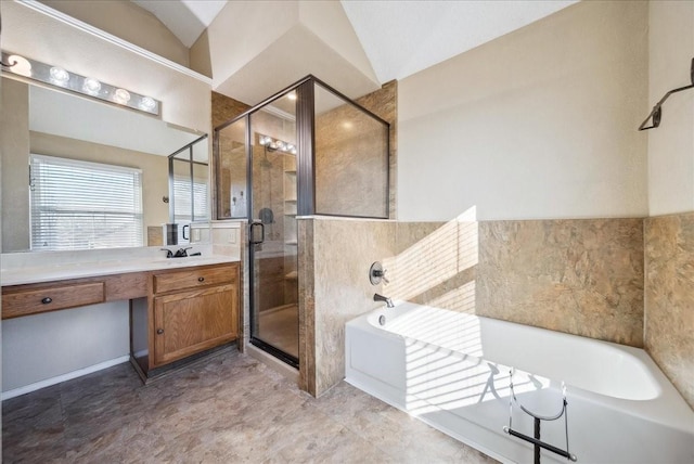 bathroom with vanity, separate shower and tub, and lofted ceiling