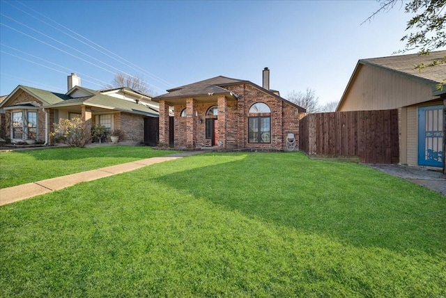 ranch-style house featuring a front lawn