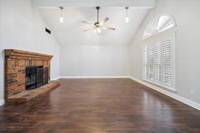 unfurnished living room with a brick fireplace, beam ceiling, dark hardwood / wood-style floors, and ceiling fan