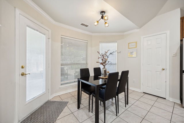 tiled dining area featuring ornamental molding