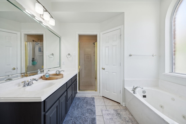 bathroom featuring vanity, shower with separate bathtub, and tile patterned flooring