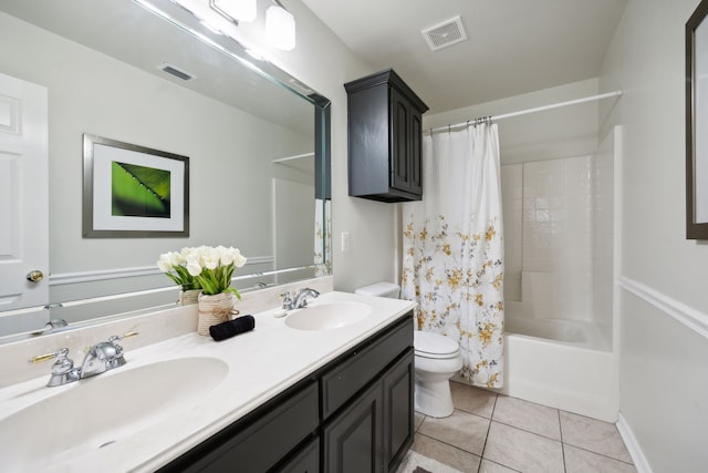 full bathroom featuring tile patterned flooring, vanity, shower / tub combo, and toilet