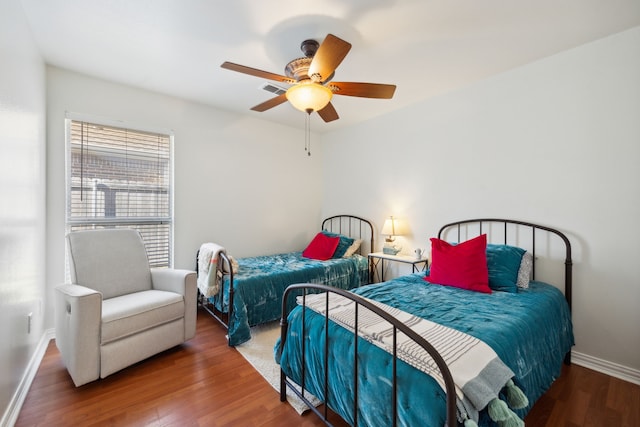 bedroom with hardwood / wood-style flooring and ceiling fan