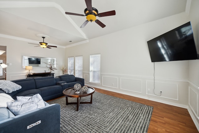 living room featuring vaulted ceiling, dark hardwood / wood-style floors, and ceiling fan