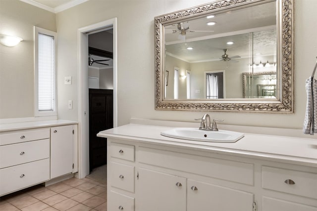 bathroom featuring tile patterned flooring, ornamental molding, vanity, and ceiling fan