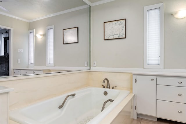 bathroom with tile patterned flooring, a bathtub, and crown molding