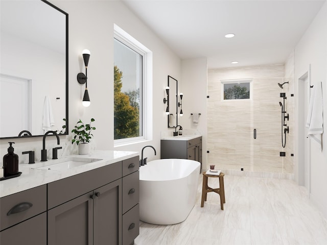 bathroom featuring vanity and independent shower and bath