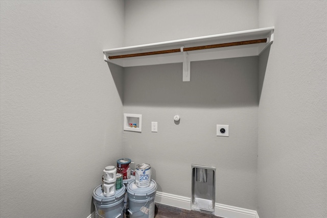 laundry room with dark hardwood / wood-style floors, hookup for a gas dryer, hookup for a washing machine, and electric dryer hookup
