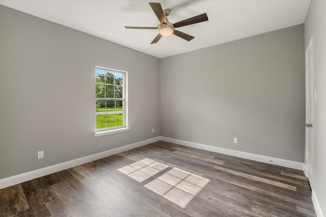 unfurnished room with dark hardwood / wood-style floors and ceiling fan