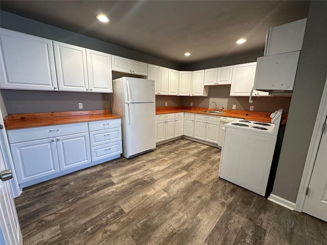 kitchen with dark wood-type flooring, sink, butcher block countertops, white cabinetry, and white appliances