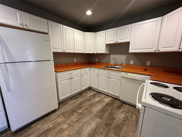 kitchen featuring wood counters, sink, white cabinetry, dark hardwood / wood-style floors, and white appliances