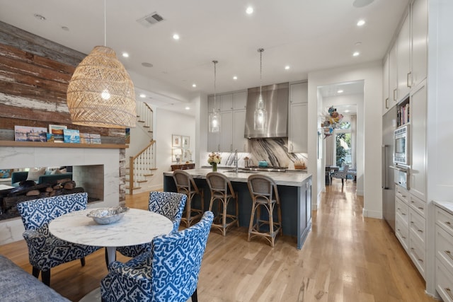 dining space with light hardwood / wood-style flooring