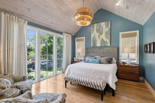 bedroom featuring wooden ceiling, vaulted ceiling, multiple windows, and light wood-type flooring