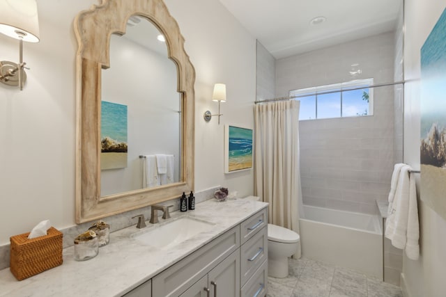 full bathroom featuring vanity, toilet, and shower / tub combo