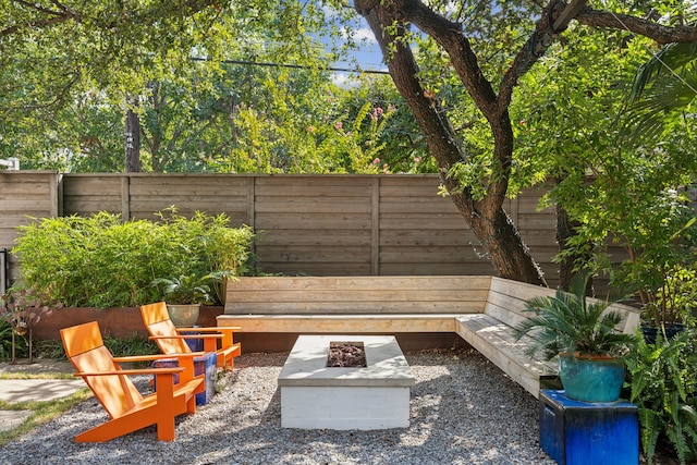 view of yard with a fire pit