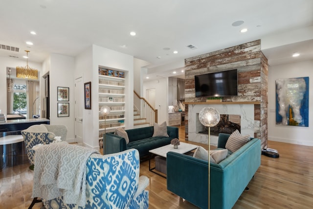 living room featuring a fireplace and light hardwood / wood-style flooring