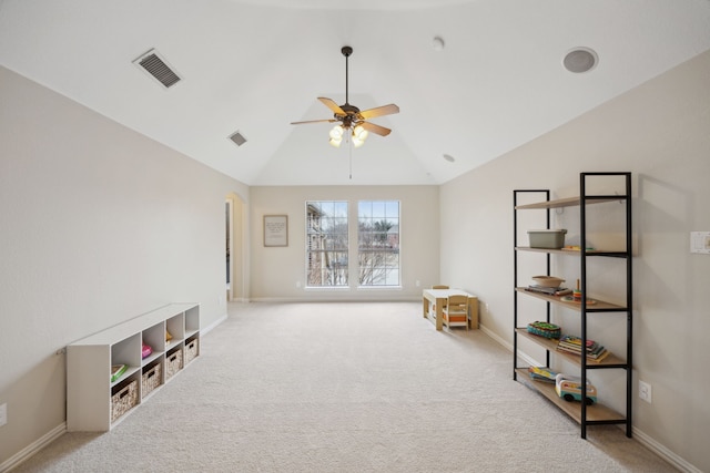 unfurnished room with light carpet, high vaulted ceiling, and ceiling fan