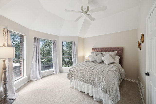 carpeted bedroom featuring ceiling fan and lofted ceiling