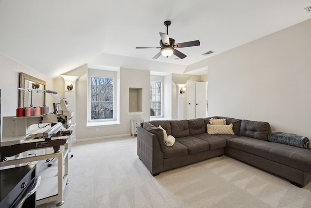 carpeted living room featuring lofted ceiling and ceiling fan