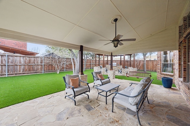 view of patio featuring ceiling fan