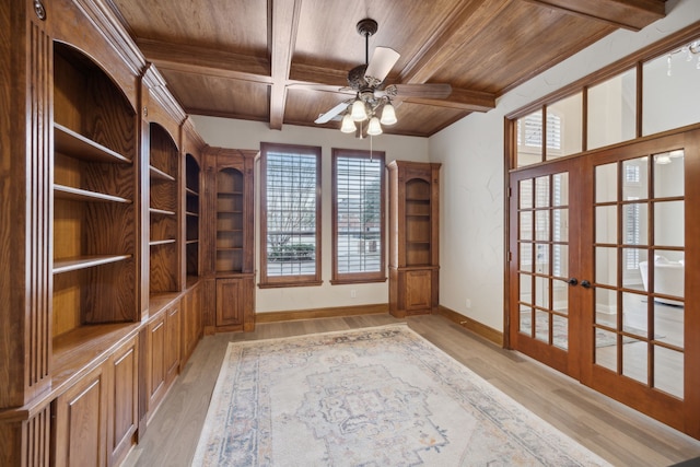 interior space with beamed ceiling, french doors, light hardwood / wood-style flooring, and wooden ceiling