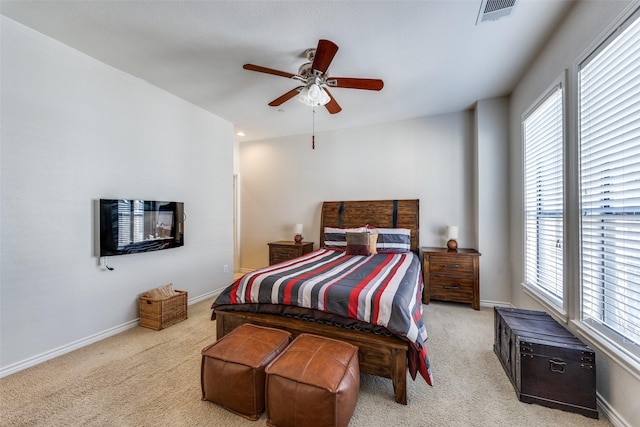 bedroom featuring light carpet and ceiling fan