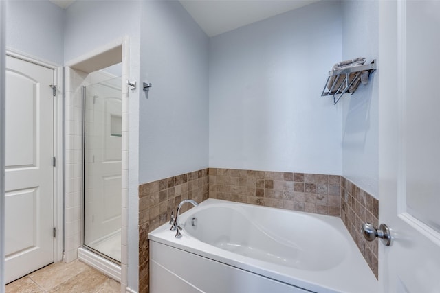 bathroom with tile patterned floors and separate shower and tub