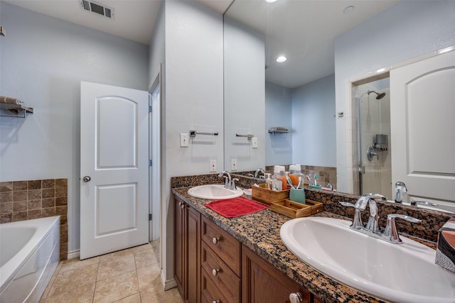 bathroom featuring tile patterned floors, shower with separate bathtub, and vanity