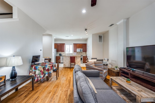 living room with light hardwood / wood-style floors