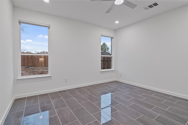 empty room featuring ceiling fan