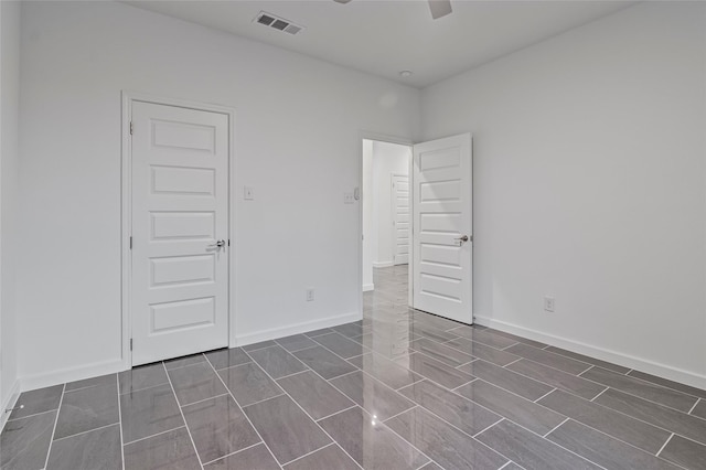 spare room featuring ceiling fan